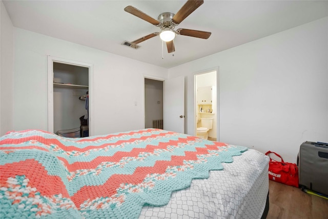 10926 Ivyridge Rd, Houston, TX 77043 - bedroom with wood finished floors, a closet, a ceiling fan, and ensuite bathroom