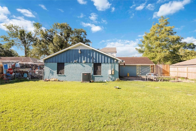 10926 Ivyridge Rd, Houston, TX 77043 - rear view of property featuring brick siding, a fenced backyard, and board and batten siding
