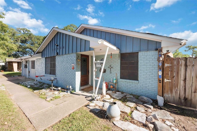 10926 Ivyridge Rd, Houston, TX 77043 - view of front of house featuring board and batten siding and brick siding