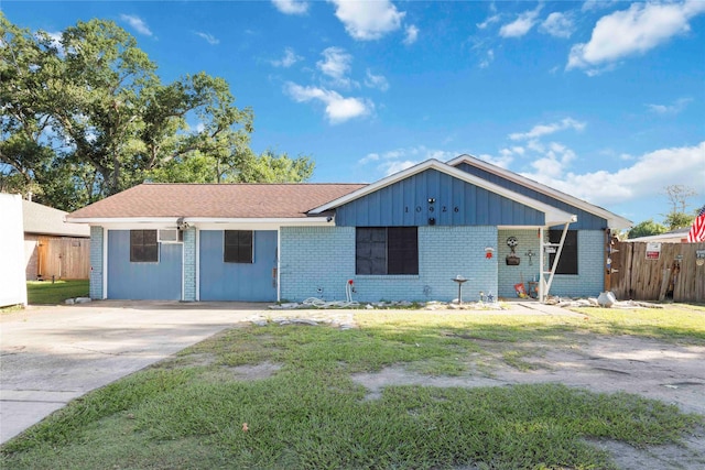 10926 Ivyridge Rd, Houston, TX 77043 - ranch-style home featuring brick siding, board and batten siding, and concrete driveway