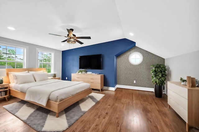 3343 Tampa St, Houston, TX 77021 - bedroom with vaulted ceiling, an accent wall, wood finished floors, a ceiling fan, and recessed lighting