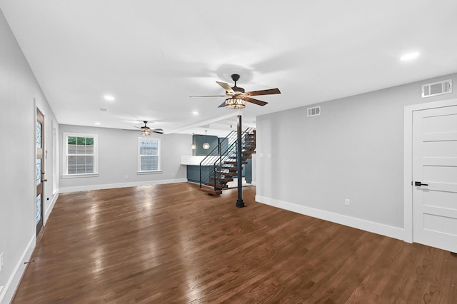 3343 Tampa St, Houston, TX 77021 - unfurnished living room featuring stairs, dark wood-style flooring, a ceiling fan, and recessed lighting