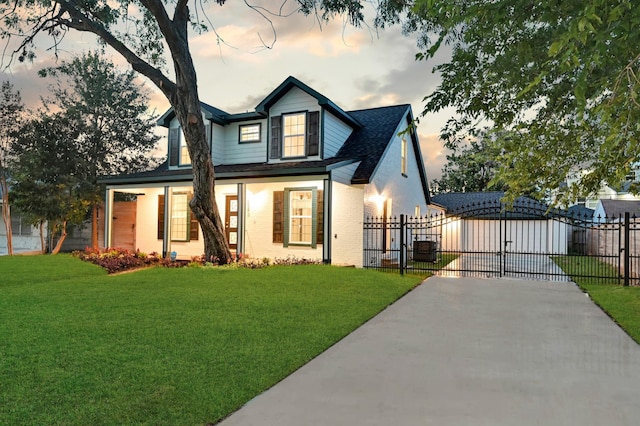 3343 Tampa St, Houston, TX 77021 - view of front of home with driveway, a gate, roof with shingles, and brick siding