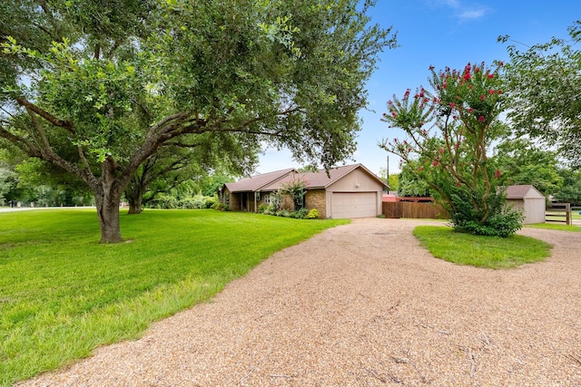 4205 Wade Rd, Brookshire, TX 77423 - view of front of property with dirt driveway and a garage