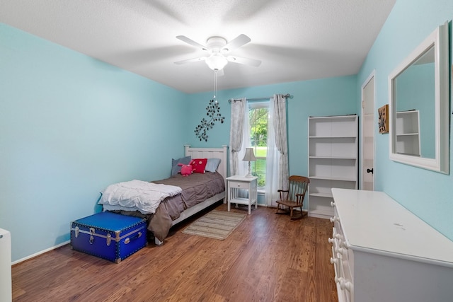 4205 Wade Rd, Brookshire, TX 77423 - bedroom featuring wood finished floors, ceiling fan, and a textured ceiling