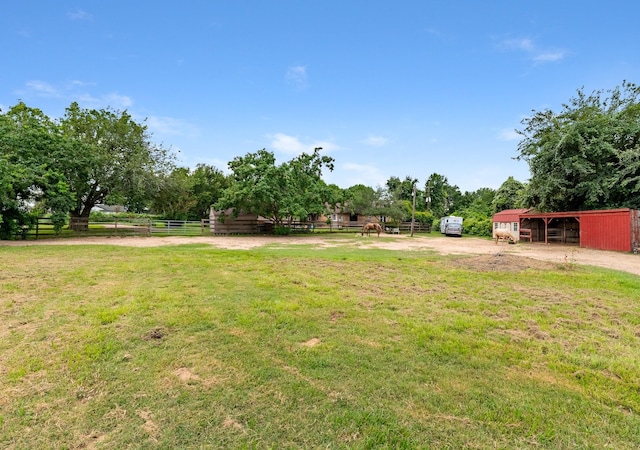 4205 Wade Rd, Brookshire, TX 77423 - view of green lawn featuring an exterior structure, an outdoor structure, and a pole building