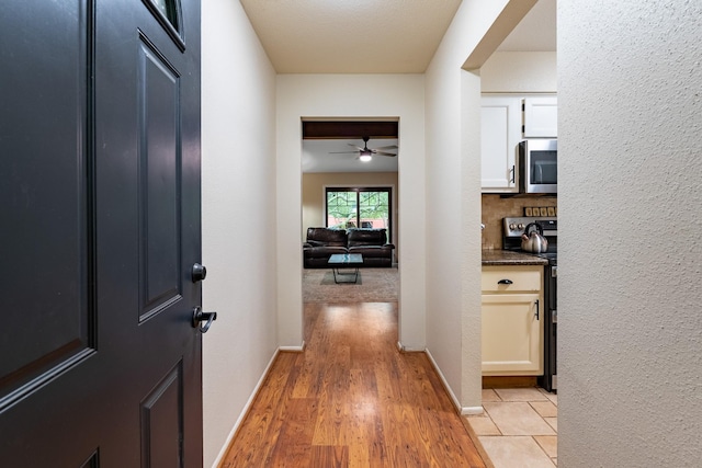 4205 Wade Rd, Brookshire, TX 77423 - hall featuring light wood finished floors and baseboards
