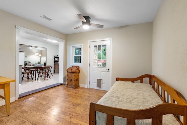 4205 Wade Rd, Brookshire, TX 77423 - bedroom with light wood finished floors and ceiling fan