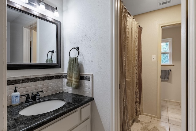 4205 Wade Rd, Brookshire, TX 77423 - full bathroom featuring vanity, tile patterned floors, and tasteful backsplash