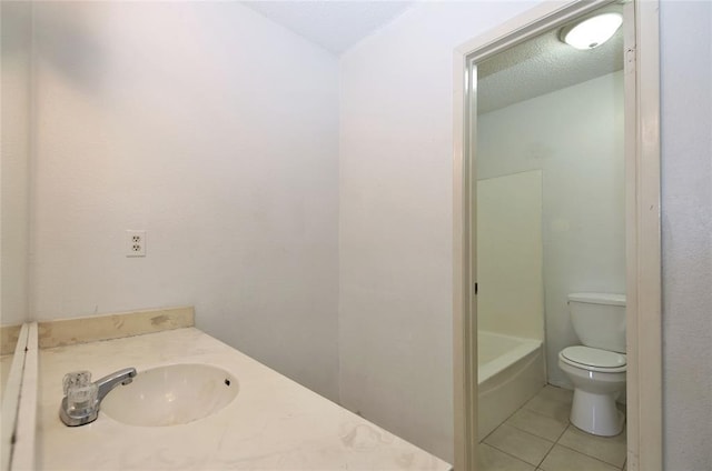 13002 Leader Unit 906, Houston, TX 77072 - bathroom with tile patterned flooring, vanity, and a textured ceiling