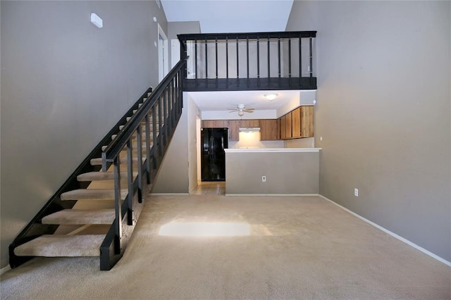 13002 Leader Unit 906, Houston, TX 77072 - stairs featuring a high ceiling, a ceiling fan, and carpet floors