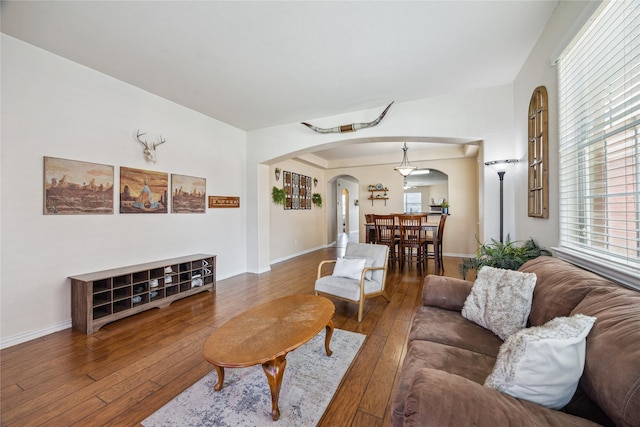 8234 Nagy Hill St, Spring, TX 77379 - living area featuring arched walkways and hardwood / wood-style floors