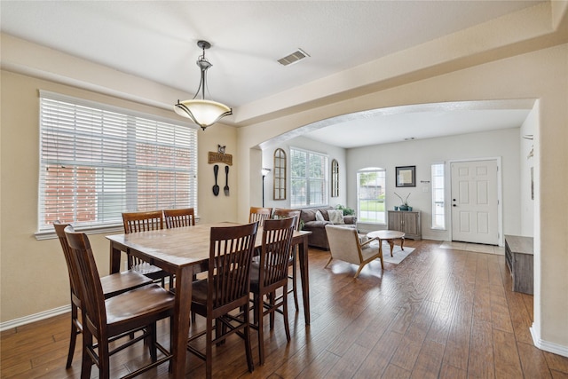 8234 Nagy Hill St, Spring, TX 77379 - dining area with arched walkways and hardwood / wood-style floors