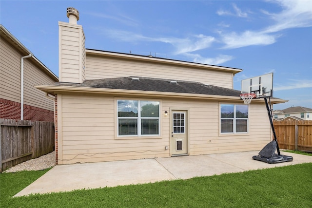 8234 Nagy Hill St, Spring, TX 77379 - back of property featuring a fenced backyard, a chimney, and a patio area