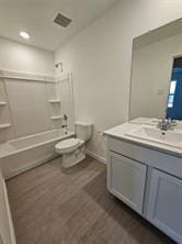 433 Tejas Trl, Waller, TX 77484 - bathroom with vanity, wood finished floors, and washtub / shower combination