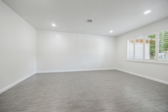 7539 Jason St, Houston, TX 77074 - empty room with recessed lighting and wood finished floors