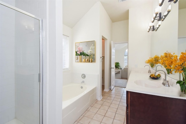 21335 Riverside Ridge Ln, Katy, TX 77449 - full bathroom with double vanity, a garden tub, tile patterned floors, a shower stall, and lofted ceiling