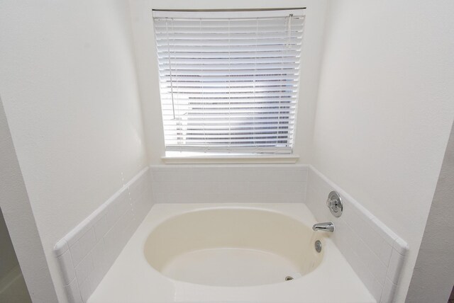 21335 Riverside Ridge Ln, Katy, TX 77449 - bathroom featuring a garden tub