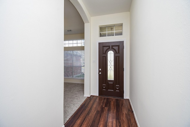 21335 Riverside Ridge Ln, Katy, TX 77449 - foyer featuring arched walkways and dark wood-style floors