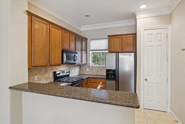 9007 Harbor Hills Dr, Houston, TX 77054 - kitchen featuring stainless steel appliances, a peninsula, brown cabinets, decorative backsplash, and crown molding