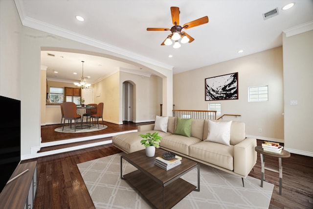 9007 Harbor Hills Dr, Houston, TX 77054 - living room with arched walkways, wood finished floors, ceiling fan, recessed lighting, and crown molding