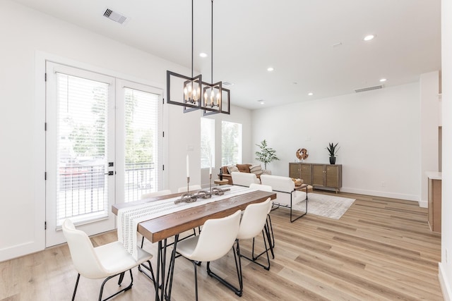1615 Erin St, Houston, TX 77009 - dining area with light wood-style flooring, a chandelier, and recessed lighting