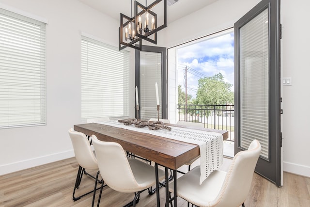 1615 Erin St, Houston, TX 77009 - dining space with a chandelier and light wood-type flooring