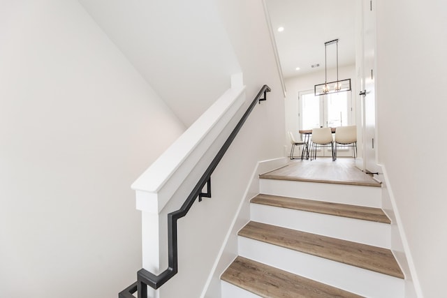 1615 Erin St, Houston, TX 77009 - staircase with a chandelier and wood finished floors
