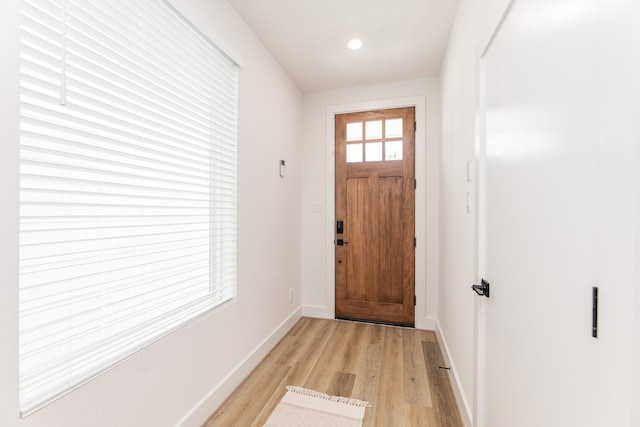 1615 Erin St, Houston, TX 77009 - doorway with light wood-style flooring and recessed lighting