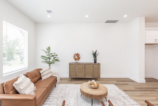 1615 Erin St, Houston, TX 77009 - living area with healthy amount of natural light, light wood finished floors, and recessed lighting
