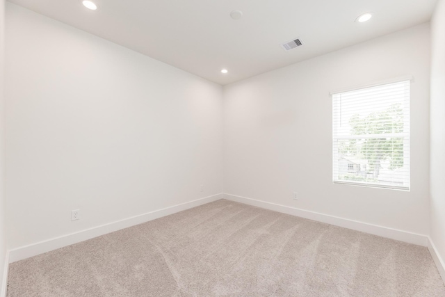 1615 Erin St, Houston, TX 77009 - unfurnished room with light carpet and recessed lighting