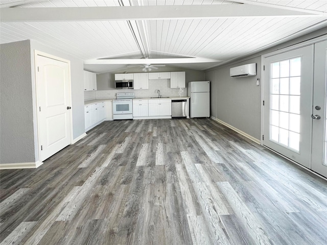 323 Texas St, Freeport, TX 77541 - unfurnished living room with an AC wall unit, dark wood-style flooring, ceiling fan, and wooden ceiling