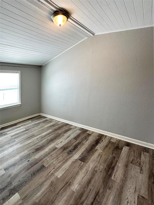 323 Texas St, Freeport, TX 77541 - empty room featuring wooden ceiling, wood finished floors, and vaulted ceiling