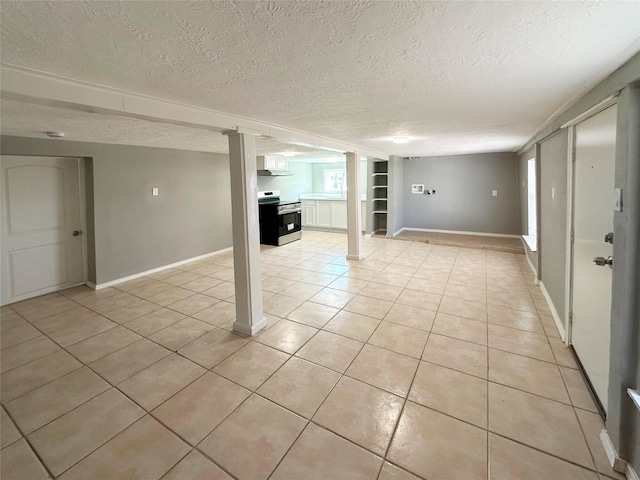 323 Texas St, Freeport, TX 77541 - below grade area featuring light tile patterned floors and a textured ceiling