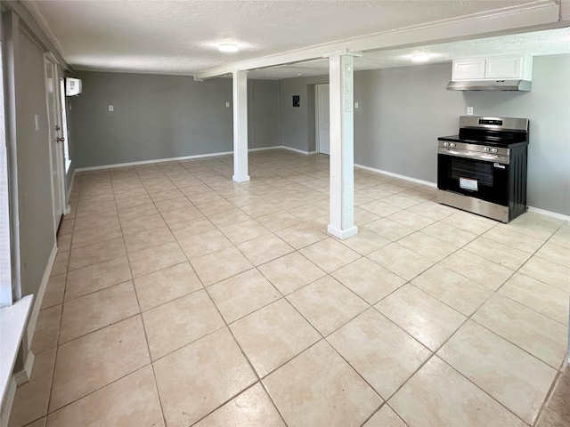 323 Texas St, Freeport, TX 77541 - finished below grade area featuring a textured ceiling and light tile patterned floors