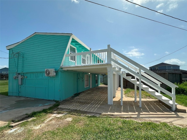 323 Texas St, Freeport, TX 77541 - view of side of property featuring a deck, stairs, and a patio area