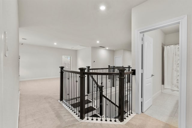 6126 Garden Lakes Ln, Sugar Land, TX 77479 - hall with an upstairs landing, recessed lighting, carpet flooring, and attic access