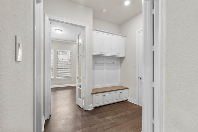 6126 Garden Lakes Ln, Sugar Land, TX 77479 - mudroom featuring dark wood finished floors and baseboards