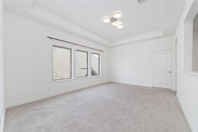 13731 Pedernales Ct, Cypress, TX 77429 - carpeted empty room with a raised ceiling and baseboards