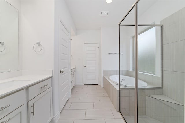 13731 Pedernales Ct, Cypress, TX 77429 - bathroom featuring vanity, a bath, and tile patterned flooring