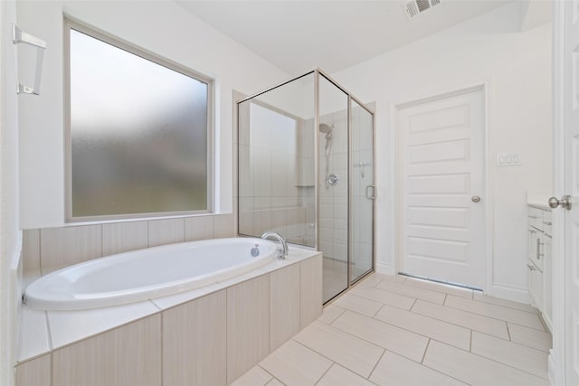 13731 Pedernales Ct, Cypress, TX 77429 - full bathroom featuring a shower stall, a bath, vanity, and tile patterned floors