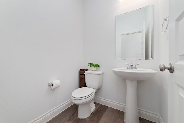 13731 Pedernales Ct, Cypress, TX 77429 - half bathroom featuring toilet and wood finished floors
