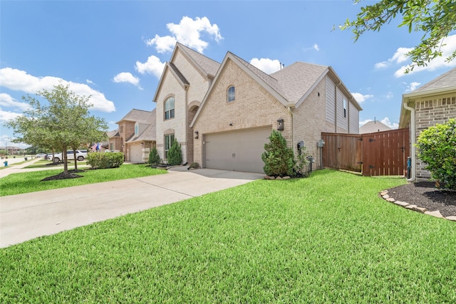 13731 Pedernales Ct, Cypress, TX 77429 - french country style house featuring brick siding, driveway, an attached garage, and a gate