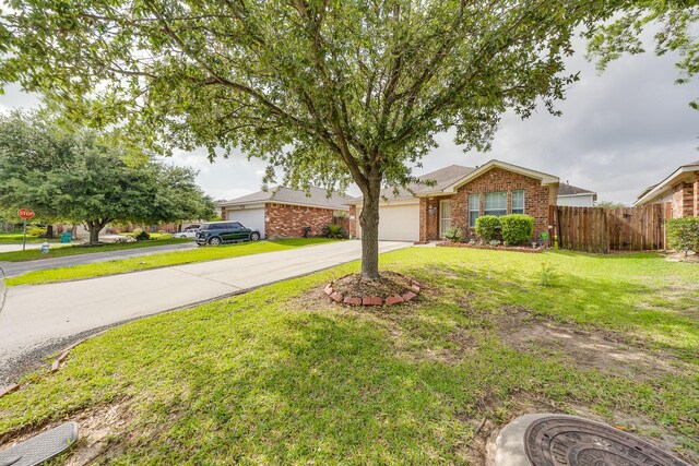 2707 Trementina Dr, Houston, TX 77088 - view of front of home with concrete driveway, brick siding, and an attached garage