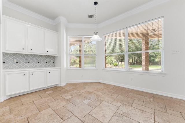 3207 W Benders Landing Blvd, Spring, TX 77386 - unfurnished dining area featuring stone tile floors, crown molding, and healthy amount of natural light