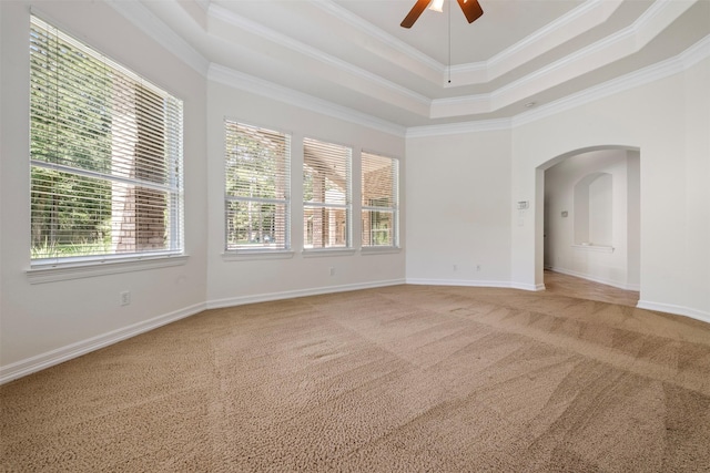 3207 W Benders Landing Blvd, Spring, TX 77386 - carpeted spare room featuring a raised ceiling, plenty of natural light, ornamental molding, arched walkways, and ceiling fan