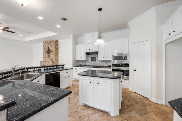 3207 W Benders Landing Blvd, Spring, TX 77386 - kitchen featuring stainless steel appliances, a large island, stone tile floors, tasteful backsplash, and under cabinet range hood