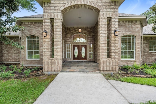 3207 W Benders Landing Blvd, Spring, TX 77386 - doorway to property featuring brick siding and a shingled roof