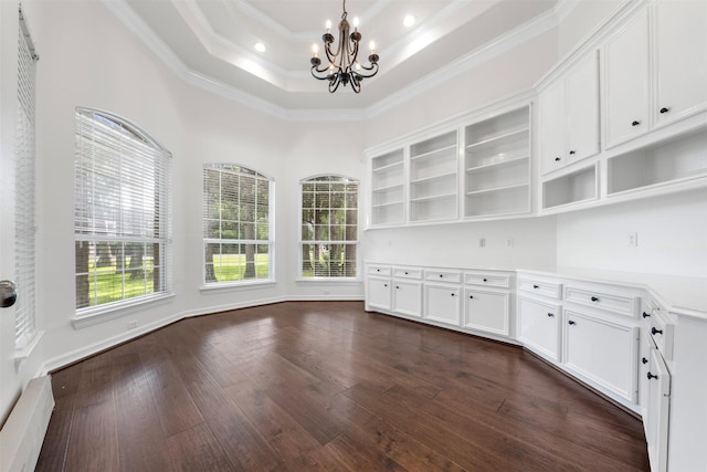 3207 W Benders Landing Blvd, Spring, TX 77386 - unfurnished dining area featuring a chandelier, crown molding, dark wood-style flooring, and a raised ceiling