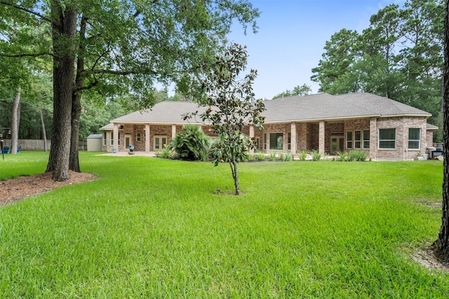 3207 W Benders Landing Blvd, Spring, TX 77386 - view of front of property with a front lawn and brick siding